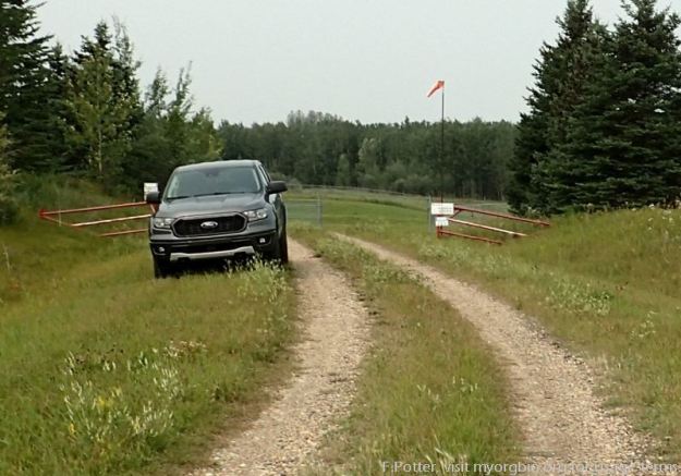 Service road to facility in the NA, looking north towards Battle Lake (beyond the trees), View, Battle Lake South NA, 2023-08-23 (F.Potter).