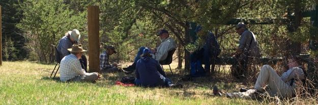 Field trippers taking a break in the shade of jack pine at Halfmoon Lake Natural Area. At the far left are stewards Vera and Richard deSmet, May 12, 2019; P. Cotterill.
