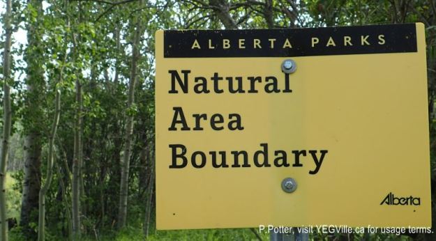 Boundary sign at the NW corner, 2024-08-14, Magee Lake NA, P. Potter.