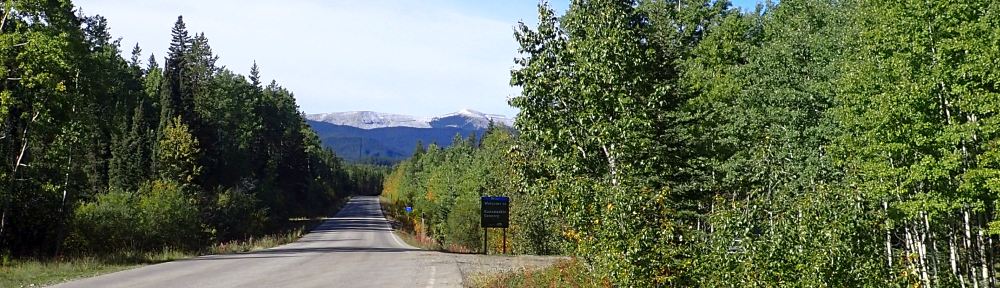 Looking west along the TWP with the NA to the right (South); parking area is mid-image, 2024-09-23, Bragg Creek NA, P. Potter.