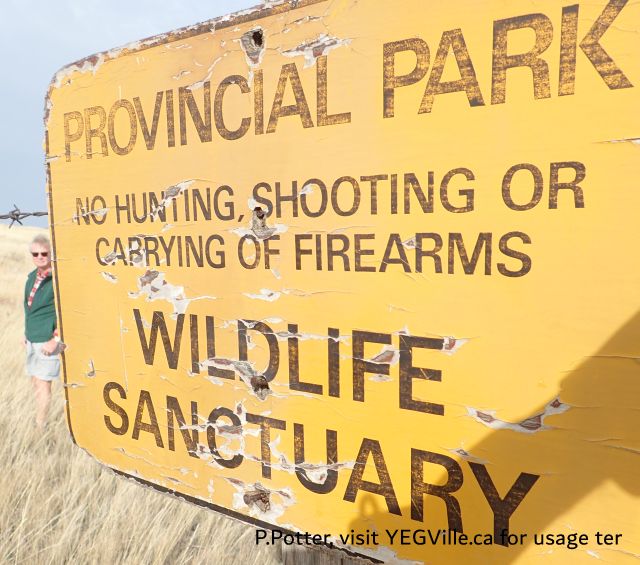 A weather beaten sign on the South border, Red Rock Coulee NA, 2024-10-16, P. Potter.